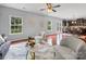 Inviting living room featuring modern decor, plush seating, and an open concept design with hardwood floors at 1307 Farm Branch Sw Dr, Concord, NC 28027