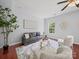 Inviting living room featuring modern decor, plush seating, and a cozy atmosphere with hardwood floors at 1307 Farm Branch Sw Dr, Concord, NC 28027