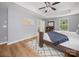 Inviting main bedroom with hardwood floors and a tray ceiling at 1307 Farm Branch Sw Dr, Concord, NC 28027