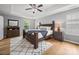 Spacious main bedroom with tray ceiling, neutral walls, and stylish furniture at 1307 Farm Branch Sw Dr, Concord, NC 28027