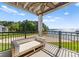 Spacious outdoor balcony has comfortable seating and an amazing view at 17811 Half Moon Ln # E, Cornelius, NC 28031