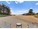 A tranquil beach area features serene lake views and comfortable seating, creating a relaxing escape at 17811 Half Moon Ln # E, Cornelius, NC 28031