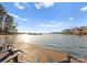 Picturesque dock with Adirondack chairs offering serene views of the water and surrounding residences at 17811 Half Moon Ln # E, Cornelius, NC 28031