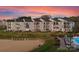Waterfront condos featuring manicured grounds, sandy beach, lake access, and community pool at 17811 Half Moon Ln # E, Cornelius, NC 28031