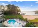 Pool view of condos with lake access, beach and lush lawn at 17811 Half Moon Ln # E, Cornelius, NC 28031