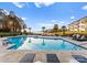 Sparkling pool offers a relaxing spot with views of the lake and palm trees at 17811 Half Moon Ln # E, Cornelius, NC 28031