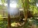 Back of home featuring a screened in porch and brick exterior surrounded by trees at 1834 Sharonwood Ln, Rock Hill, SC 29732