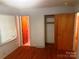 Bedroom featuring hardwood floors, a closet, and access to the bathroom at 1834 Sharonwood Ln, Rock Hill, SC 29732