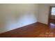 Empty room with gleaming hardwood floors and natural light at 1834 Sharonwood Ln, Rock Hill, SC 29732