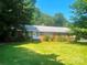 Charming brick home featuring a well-maintained lawn and inviting front entrance at 1834 Sharonwood Ln, Rock Hill, SC 29732