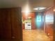 View of kitchen and dining area with white appliances and wooden paneling at 1834 Sharonwood Ln, Rock Hill, SC 29732