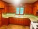 Country style kitchen featuring wood cabinets and a bright window at 1834 Sharonwood Ln, Rock Hill, SC 29732