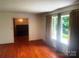 Bright living room featuring hardwood floors and large windows at 1834 Sharonwood Ln, Rock Hill, SC 29732