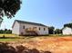 New home with a backyard deck, set against a clear sky, offers great potential for outdoor living and entertainment at 3500 14Th Sw Ave, Hickory, NC 28602