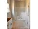 Unfinished bathroom featuring a new shower, with fixtures, complemented by a vanity area ready for completion at 3500 14Th Sw Ave, Hickory, NC 28602