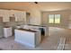 Partially finished kitchen with white cabinetry, island, and a view of the yard through a window at 3500 14Th Sw Ave, Hickory, NC 28602