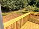 Wooden deck overlooking a private backyard with mature trees and open green space at 3506 14Th Sw Ave, Hickory, NC 28602