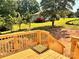 A wooden deck provides a view of the landscaped backyard and neighboring homes at 3506 14Th Sw Ave, Hickory, NC 28602