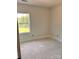 Bright bedroom featuring neutral walls, white trim, and a view of a green landscape at 3506 14Th Sw Ave, Hickory, NC 28602