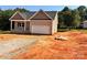 Charming single-Gathering home with a two-car garage and gravel driveway, set against lush trees at 3506 14Th Sw Ave, Hickory, NC 28602