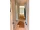 Hallway perspective showcasing neutral walls and a view into an open concept living space at 3506 14Th Sw Ave, Hickory, NC 28602
