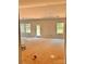 Bright living room featuring many windows, neutral walls, and a door to a deck at 3506 14Th Sw Ave, Hickory, NC 28602