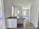 Bright kitchen with granite countertops and an open view to the living area at 405 S South St, Gastonia, NC 28052