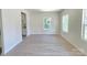 Bright living room with beautiful, light-colored laminate floors and natural light at 405 S South St, Gastonia, NC 28052