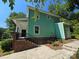 This home's side exterior features well-maintained green siding and concrete steps at 405 S South St, Gastonia, NC 28052