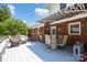 Charming back porch with awning, outdoor seating, and classic brick exterior at 4121 Dover St, Claremont, NC 28610