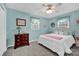 Serene bedroom with multiple windows offering ample natural light, and soft blue walls at 4121 Dover St, Claremont, NC 28610