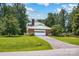 View of the brick home and manicured lawn from the street at 4121 Dover St, Claremont, NC 28610