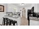 Well-lit kitchen featuring stainless steel appliances, granite countertops, and tiled floors at 4121 Dover St, Claremont, NC 28610