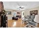 Comfortable living room with brick fireplace, plush seating, and hardwood floors throughout at 4121 Dover St, Claremont, NC 28610