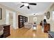 Bright living room featuring hardwood floors, neutral wall colors, and ample natural light at 4121 Dover St, Claremont, NC 28610