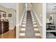 Carpeted stairs lead to the upper level of the home at 4121 Dover St, Claremont, NC 28610