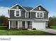 Charming two-story home with gray siding, white trim, and a two-car garage at 4453 Family Trail Dr, Indian Land, SC 29707