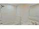 Bathroom with white subway tile, shower, tub and stone vanity at 5511 Milhaven Ln, Charlotte, NC 28269