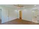 Bedroom with hardwood floors and white doors leading to a closet and bathroom at 5511 Milhaven Ln, Charlotte, NC 28269