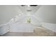 Bright, airy bonus room with carpet, windows, built-in bench, and a half-wall overlooking the space at 5511 Milhaven Ln, Charlotte, NC 28269