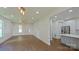 Bright, open living room featuring hardwood floors, recessed lighting, and a modern kitchen area at 5511 Milhaven Ln, Charlotte, NC 28269