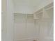 Walk-in closet with built in shelving and storage at 5511 Milhaven Ln, Charlotte, NC 28269