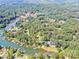 Aerial view of the lakefront community featuring mature trees and lake access at 7039 Executive Cir, Denver, NC 28037