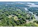 Aerial view of a lakeside community with lush greenery and community lake access at 7039 Executive Cir, Denver, NC 28037