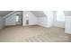 Large attic space with neutral carpeting and bright lighting at 7039 Executive Cir, Denver, NC 28037