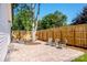 Inviting stone patio with seating area set within a verdant and private backyard at 7039 Executive Cir, Denver, NC 28037