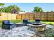 Cozy backyard patio featuring a fire pit and comfortable seating area at 7039 Executive Cir, Denver, NC 28037