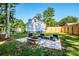 Inviting backyard with a brick patio and fire pit, perfect for outdoor entertaining at 7039 Executive Cir, Denver, NC 28037