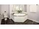 Relaxing bathroom with a soaking tub and modern fixtures at 7039 Executive Cir, Denver, NC 28037