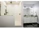 Modern bathroom featuring a glass-enclosed shower and double vanity at 7039 Executive Cir, Denver, NC 28037